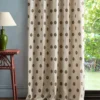 brown spotted curtain with side table and lamps