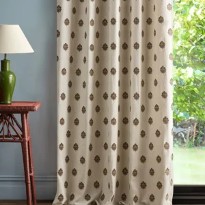 brown spotted curtain with side table and lamps
