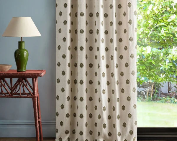 Lavanga Fabric - Avocado by green spotted curtain with side table and lamps