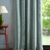 blue striped curtain with side table and lamps