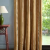 yellow striped curtain with side table and lamps