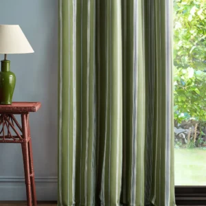 green striped curtain with side table and lamps