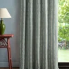 blue striped curtain with side table and lamps