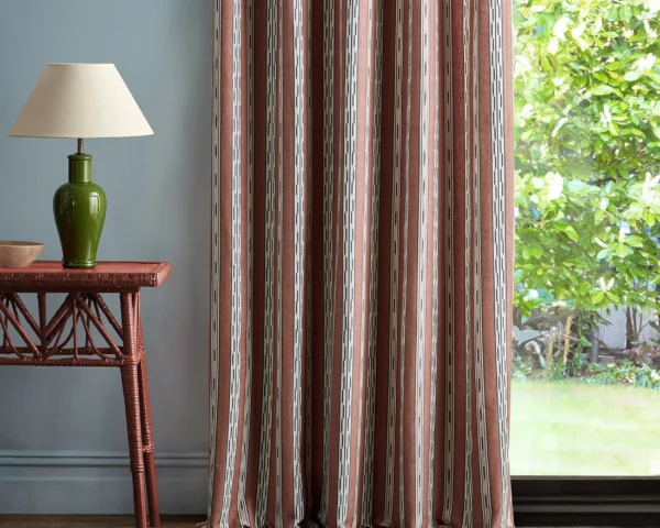 red striped curtain with side table and lamps