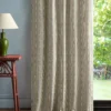 neutral striped curtain with side table and lamps