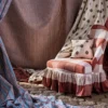 blue striped curtain with side table and lamps