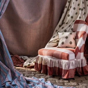 blue striped curtain with side table and lamps