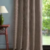red geometric curtain with side table and lamps