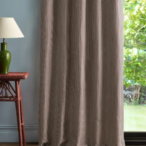 red geometric curtain with side table and lamps