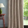 pink geometric curtain with side table and lamps