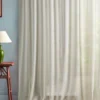 white plain curtain with side table and lamps