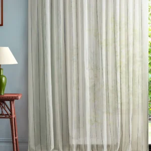 blue striped curtain with side table and lamps