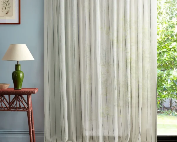 Telltale Fabric - Oceana by blue striped curtain with side table and lamps