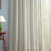 neutral striped curtain with side table and lamps