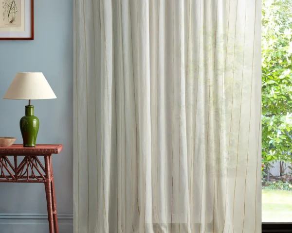neutral striped curtain with side table and lamps