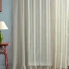 neutral striped curtain with side table and lamps