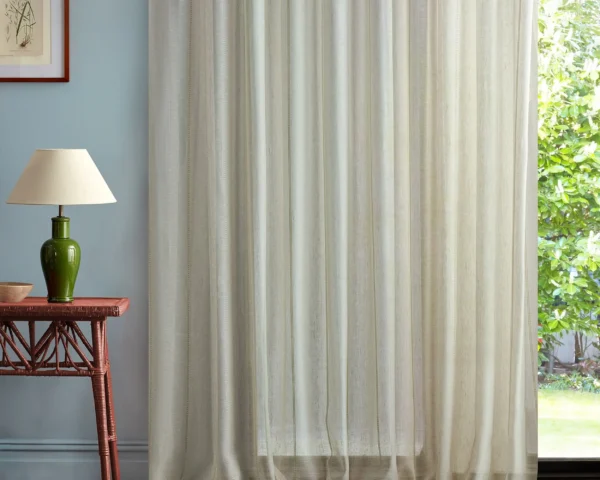 neutral striped curtain with side table and lamps