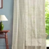 multicolour striped curtain with side table and lamps