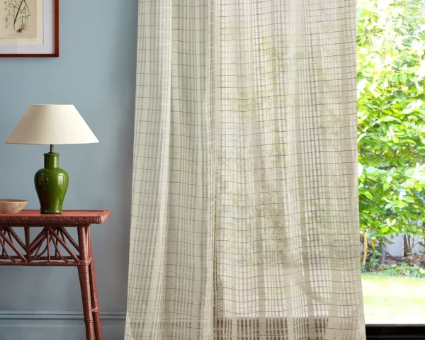 Seastack Fabric - Sunsoaked by multicolour striped curtain with side table and lamps