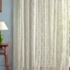 neutral botanical curtain with side table and lamps