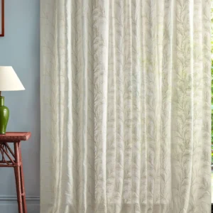 neutral botanical curtain with side table and lamps