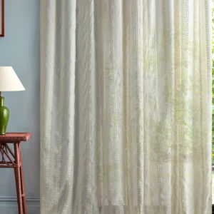 neutral striped curtain with side table and lamps