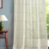 multicolour striped curtain with side table and lamps