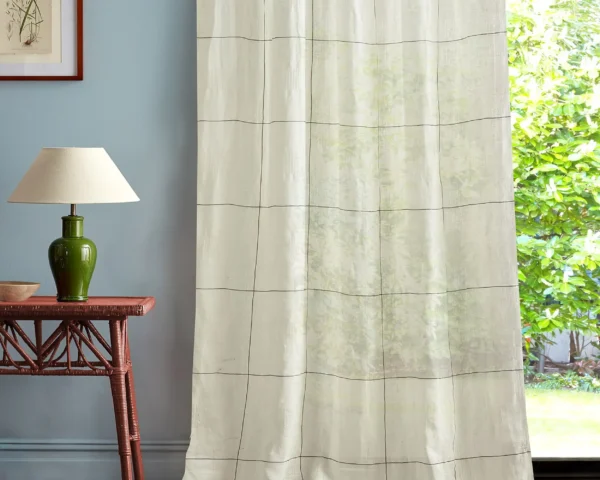multicolour striped curtain with side table and lamps