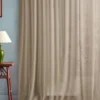 neutral plain curtain with side table and lamps