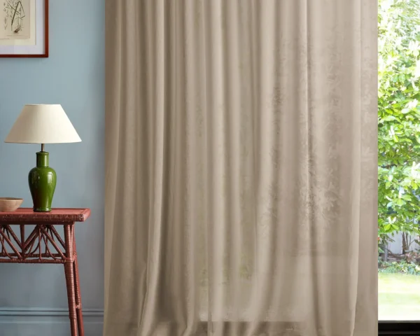 Marisol Fabric - Sunsoaked by neutral plain curtain with side table and lamps