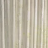 neutral checked curtain with side table and lamps