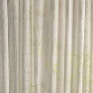 neutral checked curtain with side table and lamps