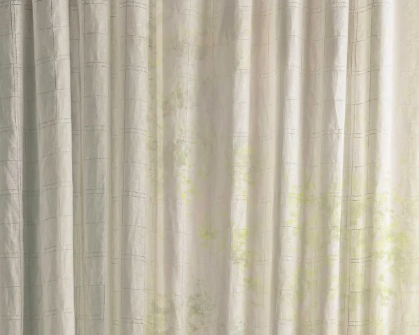 neutral checked curtain with side table and lamps