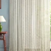 neutral botanical curtain with side table and lamps