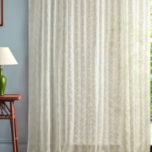 neutral botanical curtain with side table and lamps