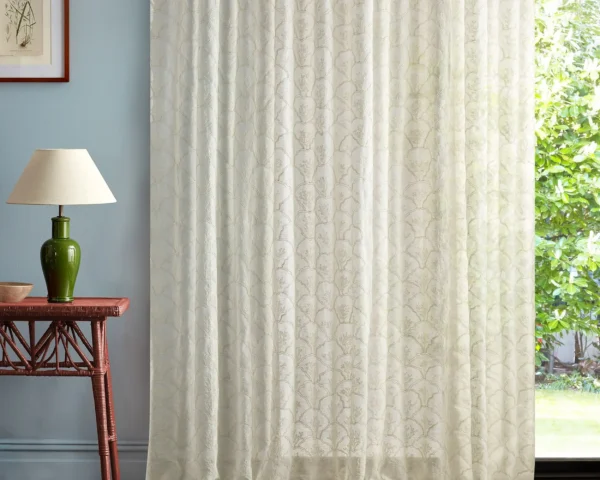 neutral botanical curtain with side table and lamps