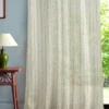 multicolour striped curtain with side table and lamps