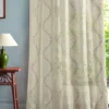 multicolour botanical curtain with side table and lamps