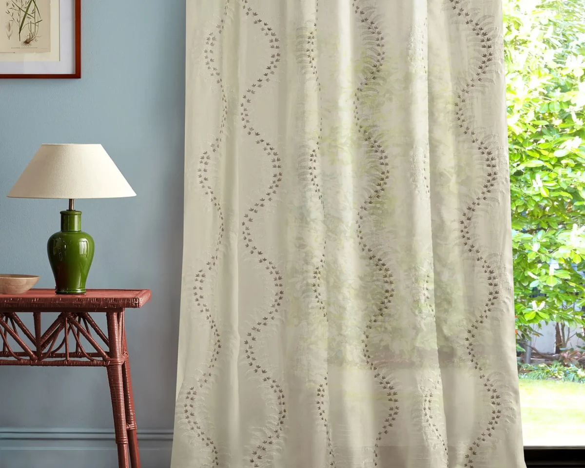 multicolour botanical curtain with side table and lamps