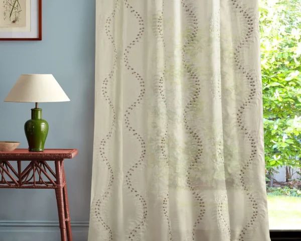 multicolour botanical curtain with side table and lamps