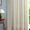 white geometric curtain with side table and lamps