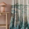 blue botanical curtain with side table and lamps