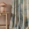 blue contemporary curtain with side table and lamps