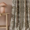neutral contemporary curtain with side table and lamps