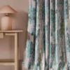 pink contemporary curtain with side table and lamps