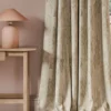 neutral contemporary curtain with side table and lamps