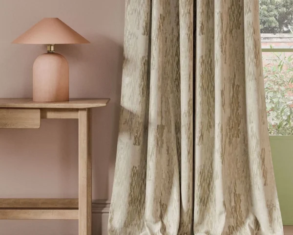 neutral contemporary curtain with side table and lamps
