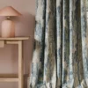 blue contemporary curtain with side table and lamps
