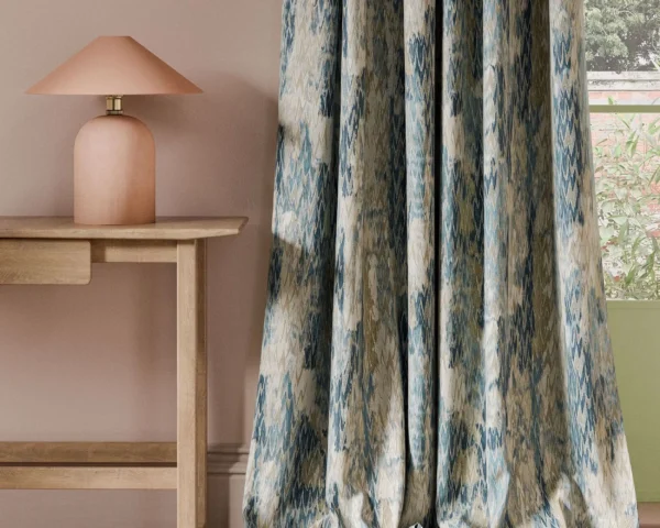 blue contemporary curtain with side table and lamps