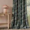 blue botanical curtain with side table and lamps